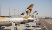 a group of airplanes parked on a tarmac