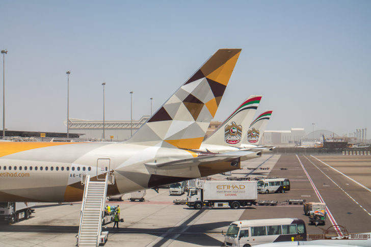 a group of airplanes parked on a tarmac