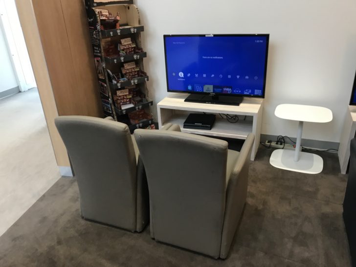 a tv and chair in a room