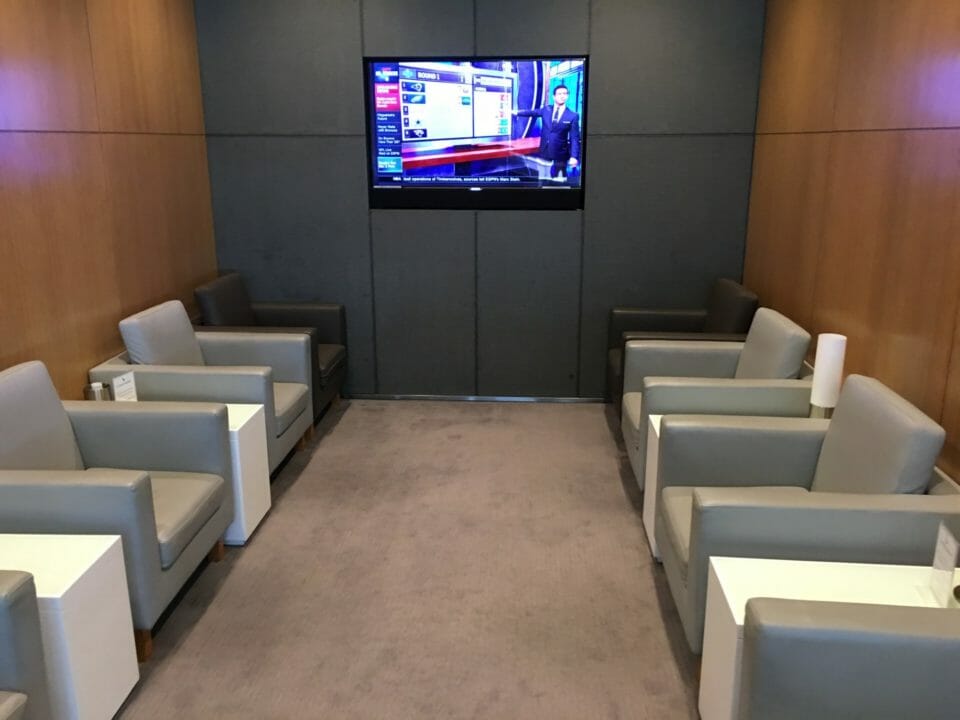 a room with a television on the wall