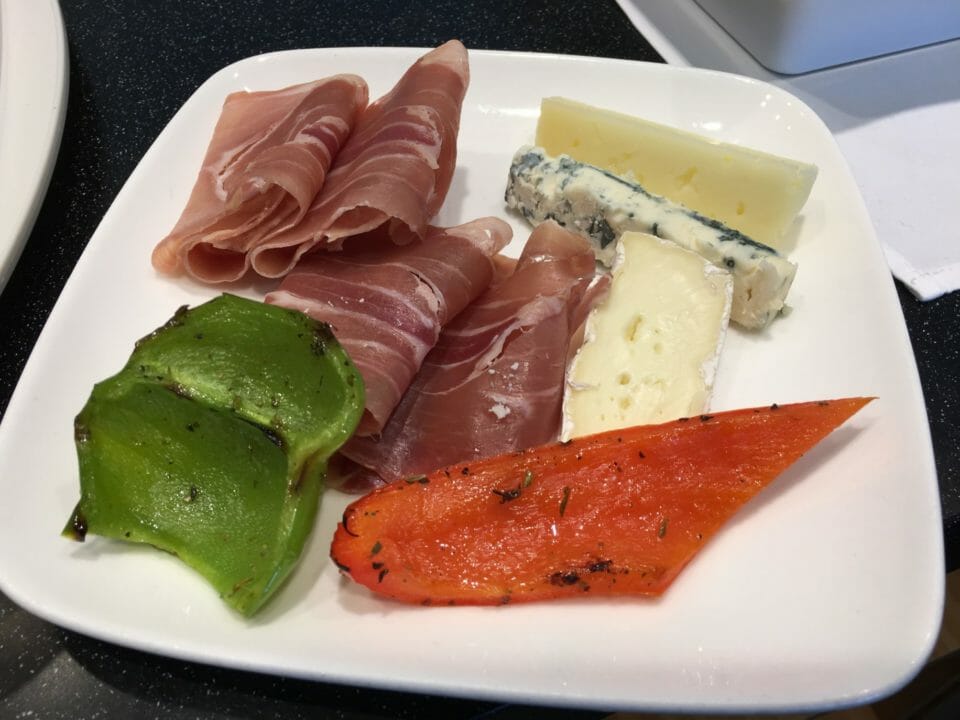 a plate of food on a black surface