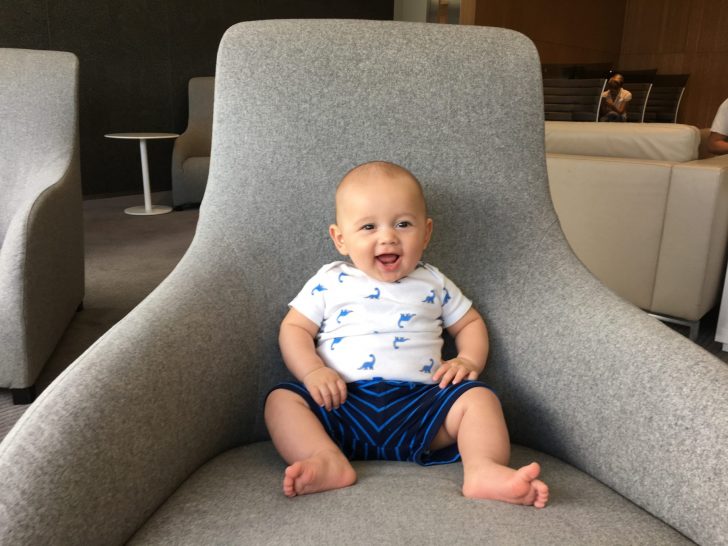 a baby sitting in a chair