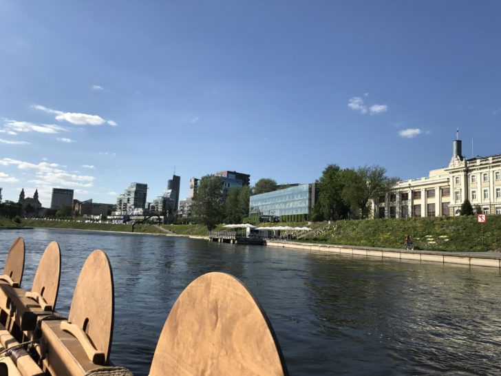 a body of water with buildings and trees