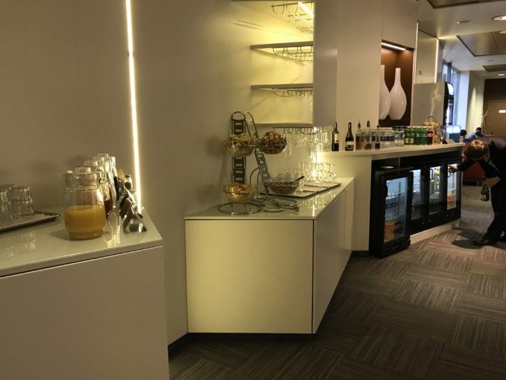a bar with drinks and glasses
