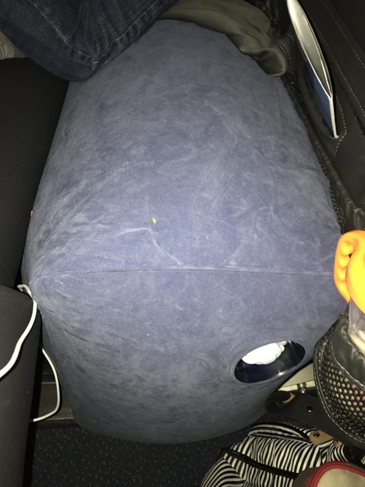 a blue pillow with holes in it