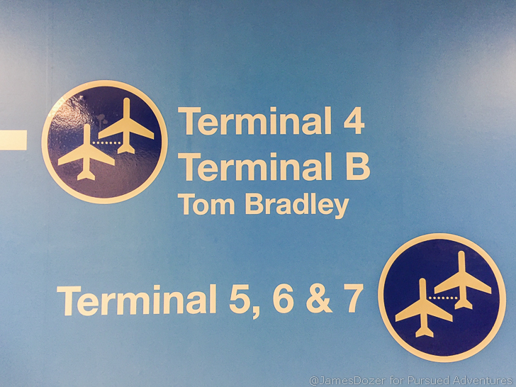 a blue sign with white text and blue circles with white text