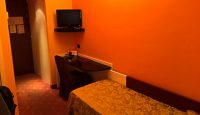 a room with a bed and a desk