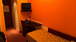 a room with a bed and a desk