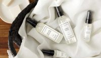 a basket with a few bottles of perfume