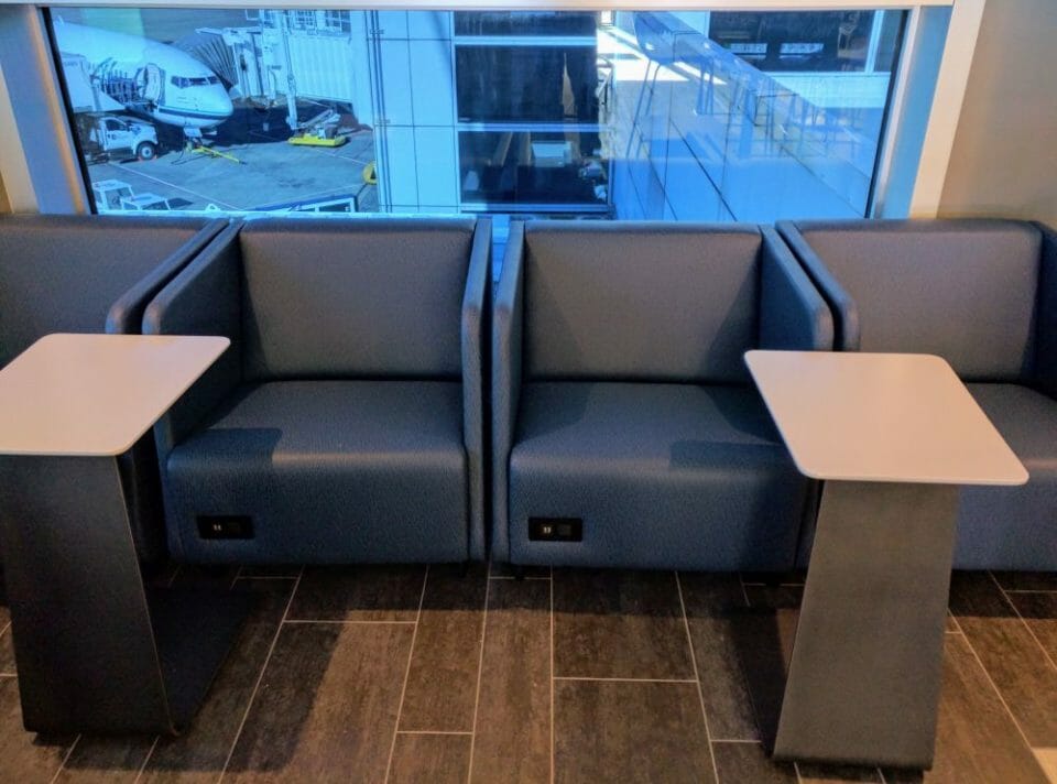 a group of chairs and tables in a room