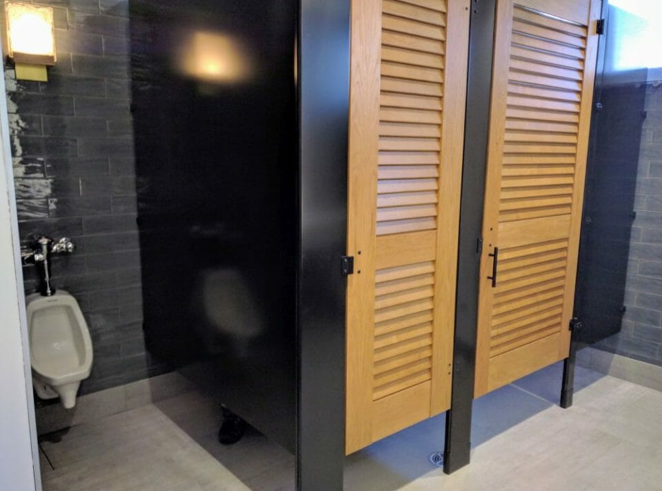 a bathroom with wooden doors