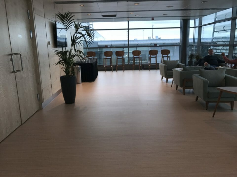 a room with chairs and a window