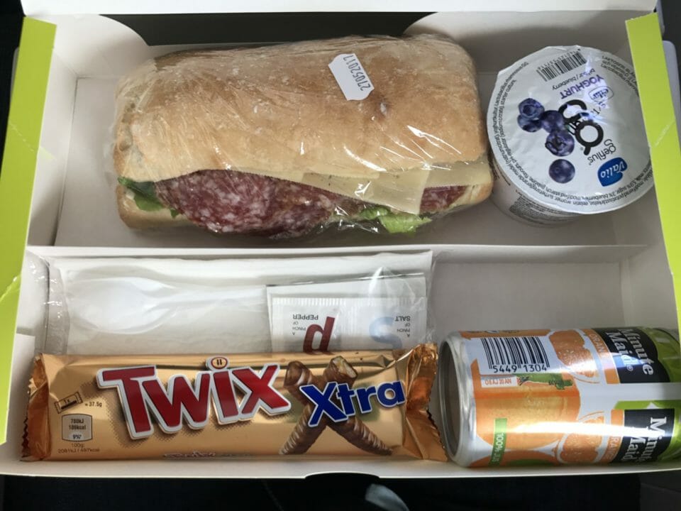 a sandwich and candy in a box