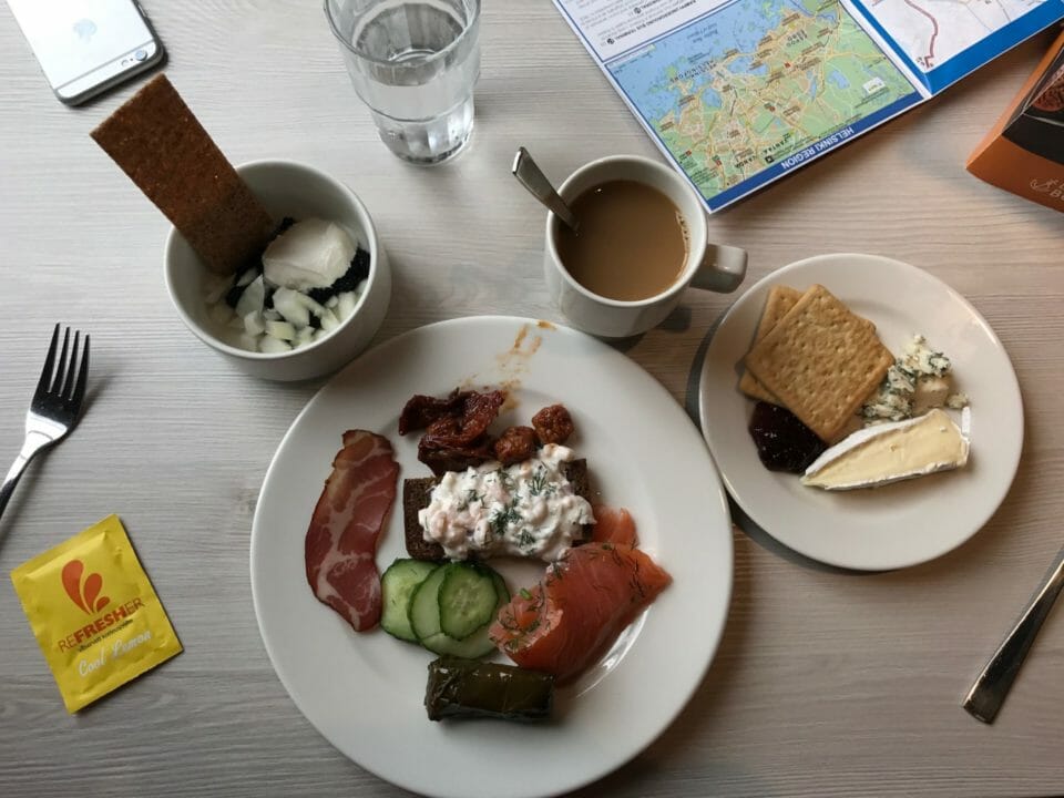 a plate of food and a cup of coffee