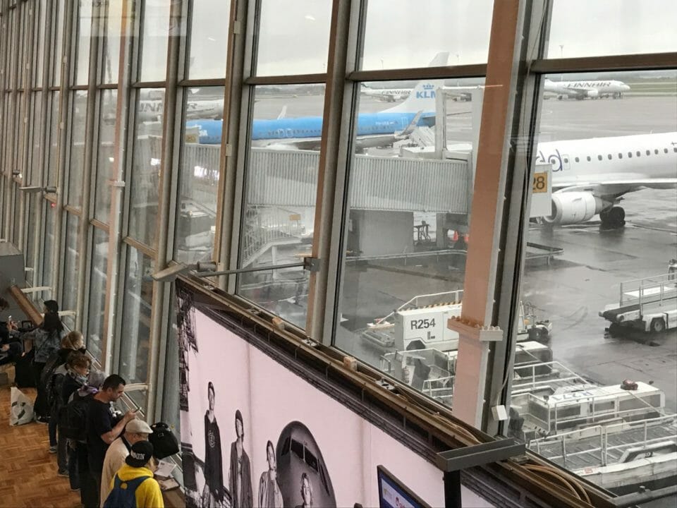 a group of people standing in a terminal