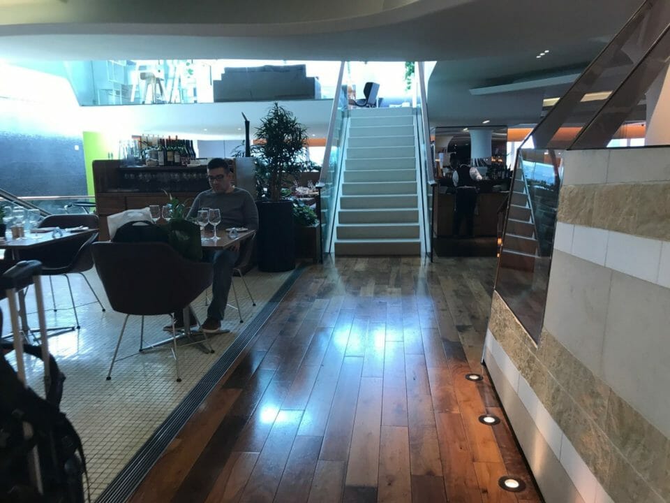 a man sitting at a table in a restaurant