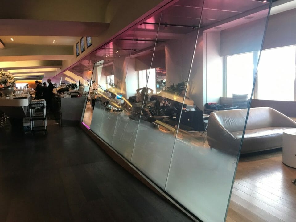 a glass wall with a pink and purple border