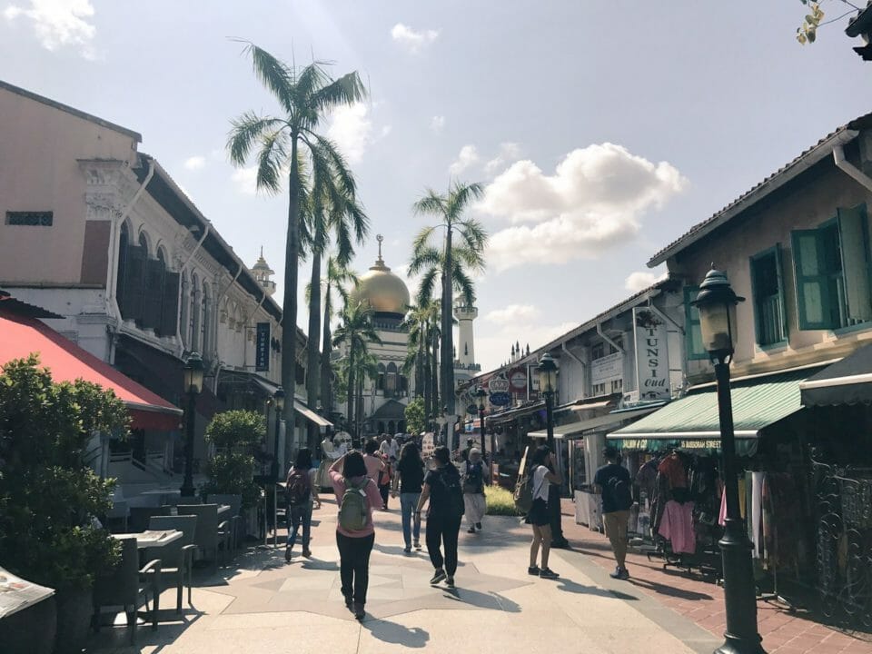 a group of people walking down a street