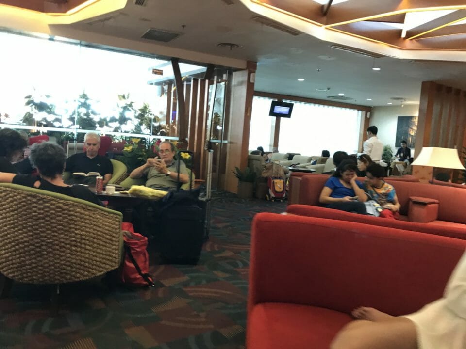 a group of people sitting in a lounge area