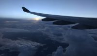 an airplane wing in the sky