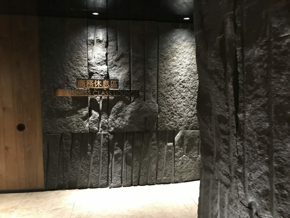 a stone wall with a sign