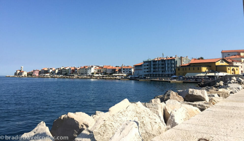 a group of buildings next to a body of water