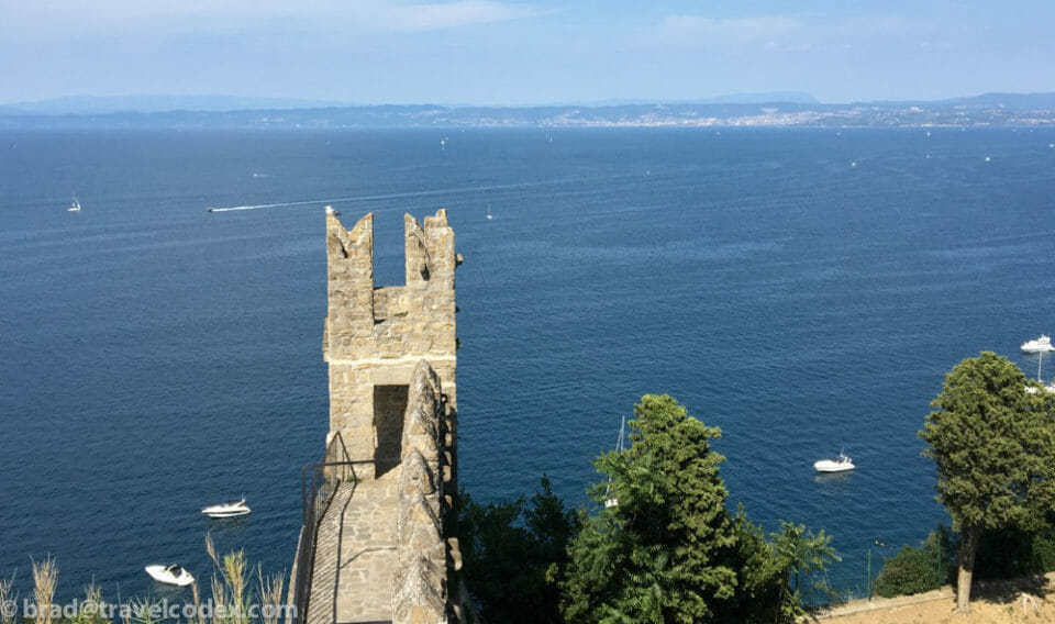 a stone tower over water