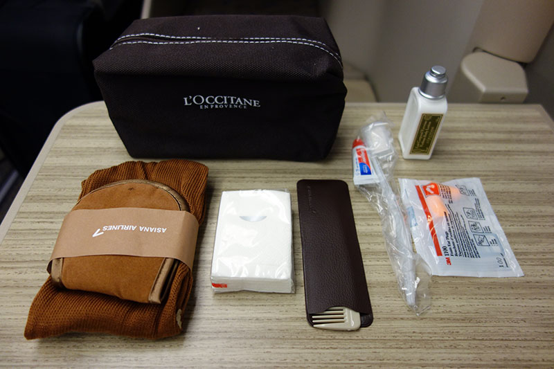 a small black bag with items on it