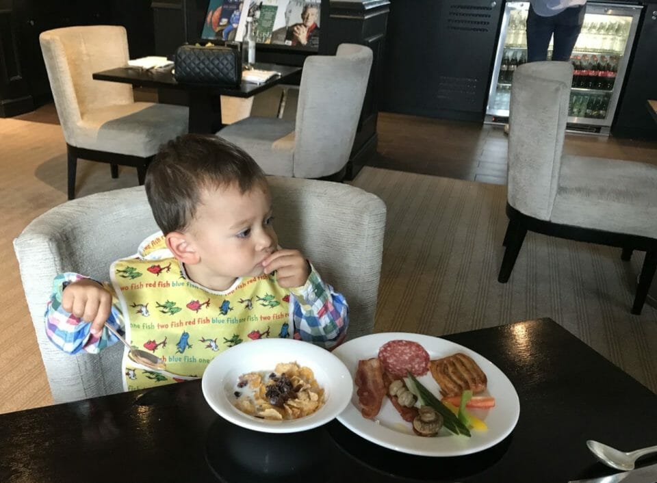 a child eating food at a restaurant