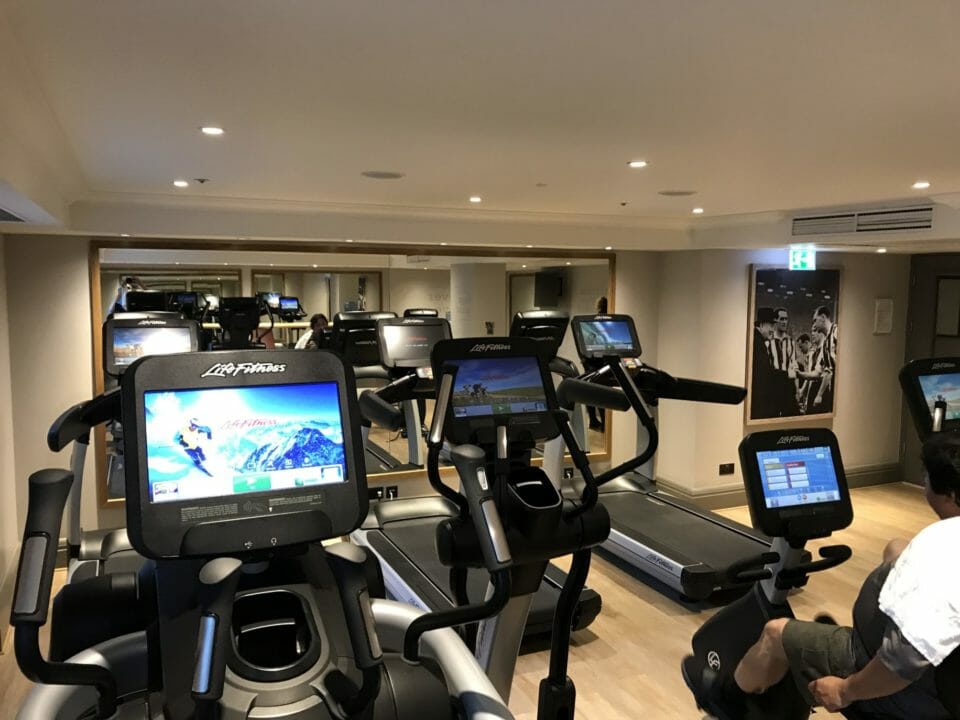 a man on treadmills in a gym