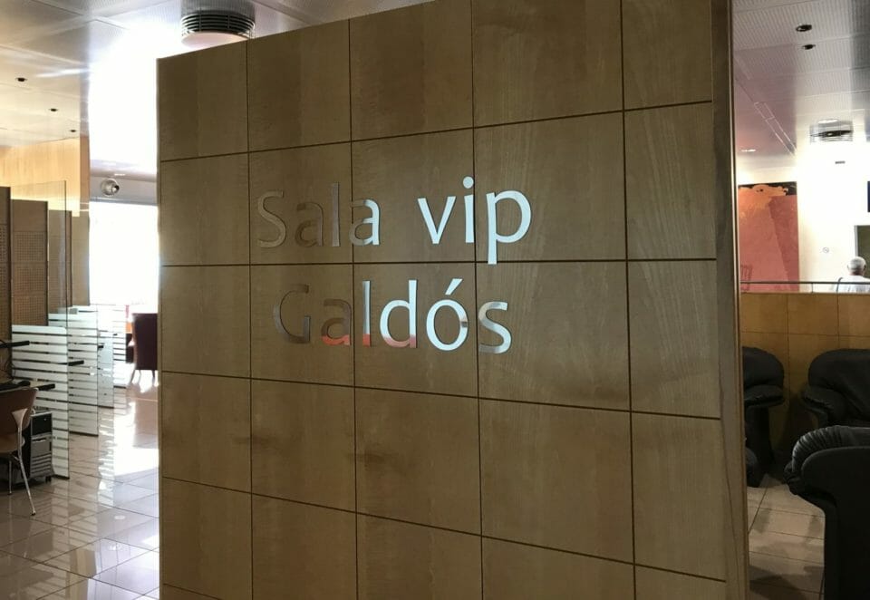 a wood panel with a sign on it