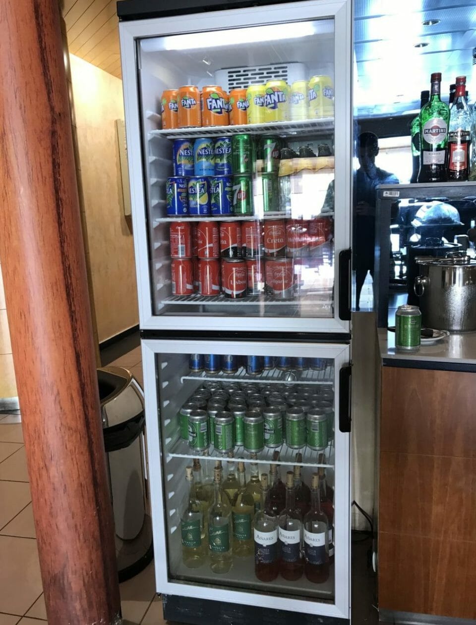 a refrigerator with drinks and beverages