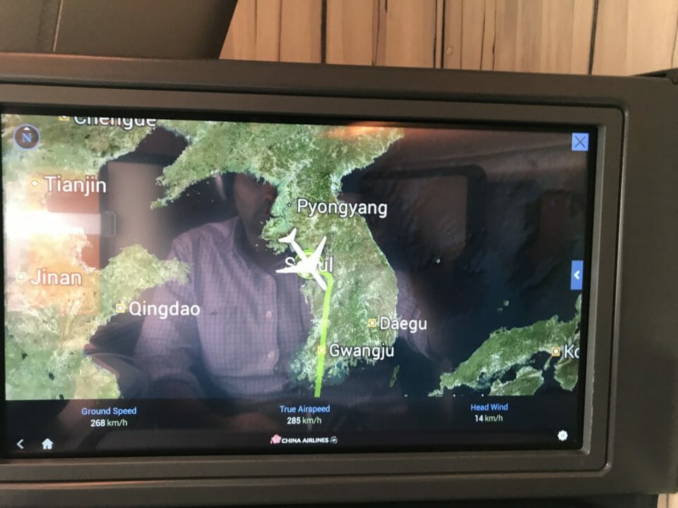 a screen with a map and a plane on it