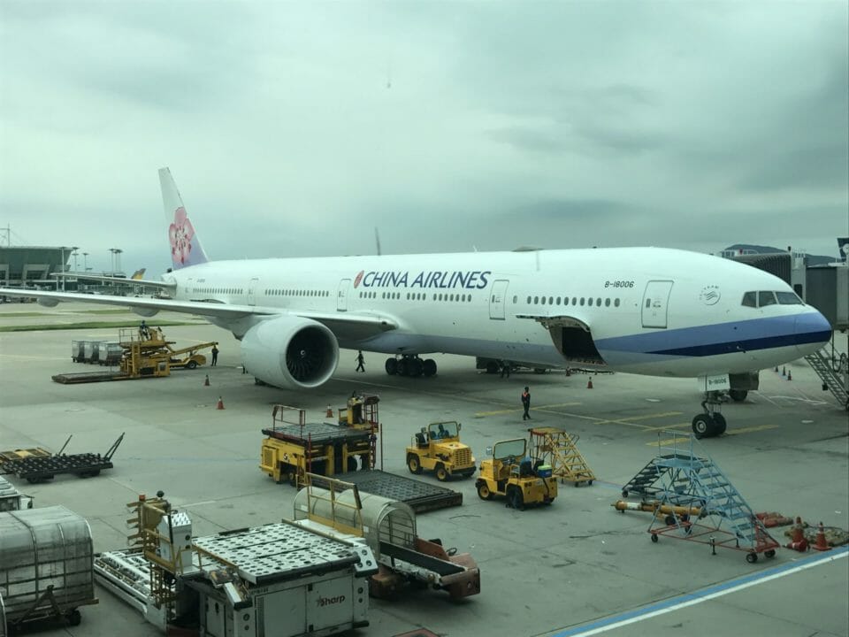 a large white airplane on a tarmac