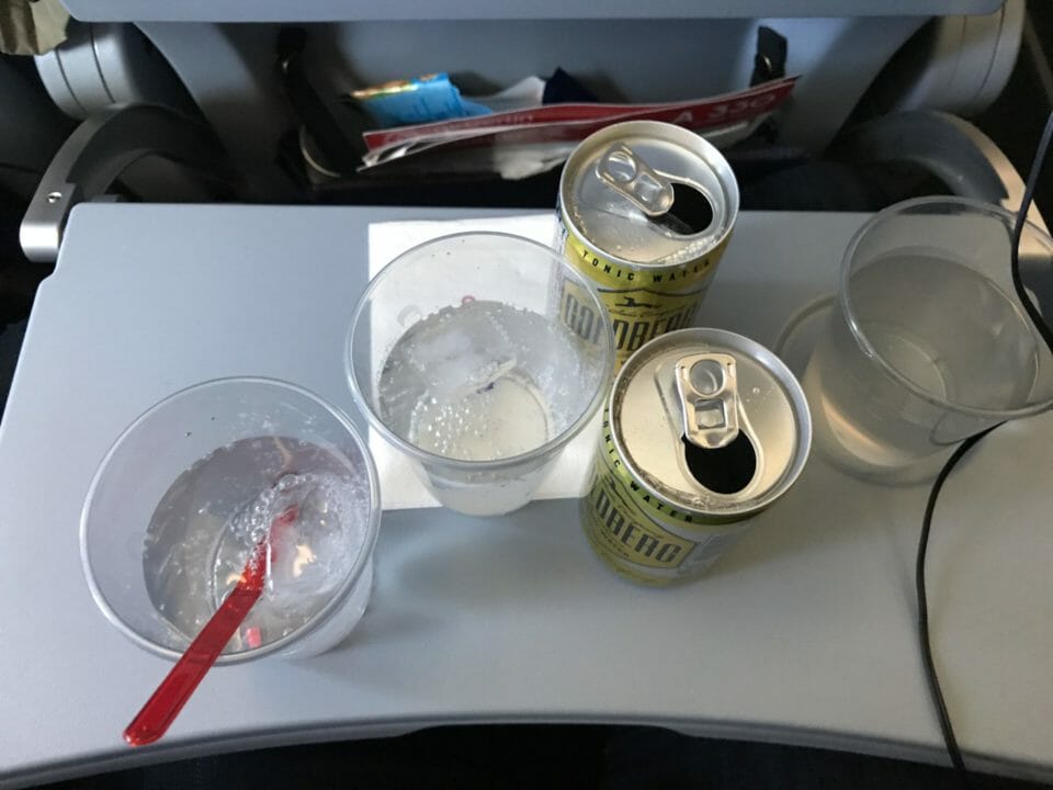 a group of empty drinks and cans on a table
