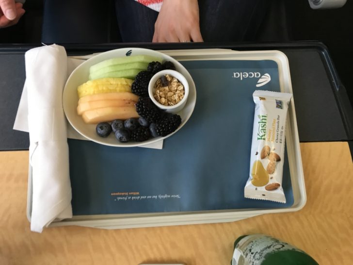a tray with fruit and cereal on it