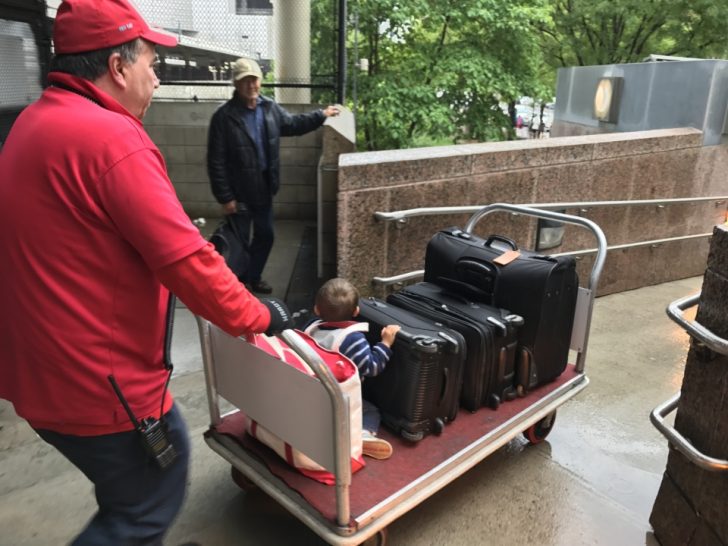 a man pushing a cart with luggage