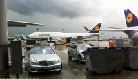 a group of cars and a plane