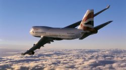 a plane flying above the clouds