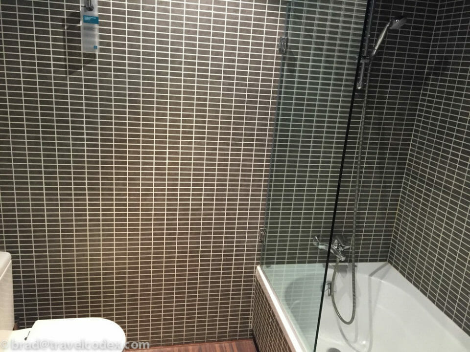 a bathroom with a shower and a toilet
