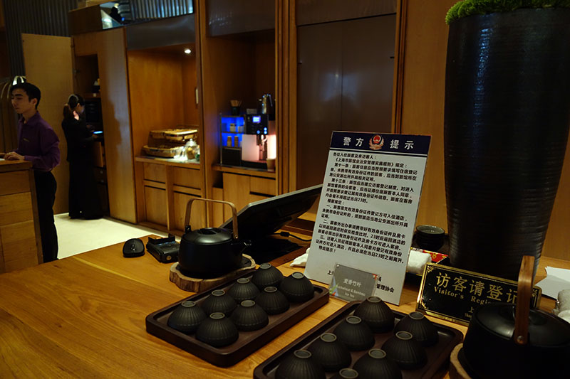 a table with a sign and a tray of food