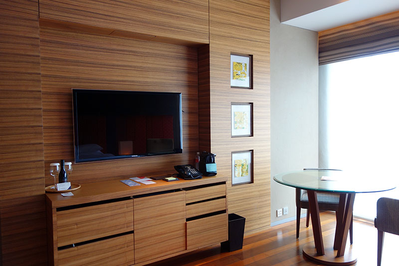 a room with a table and a television