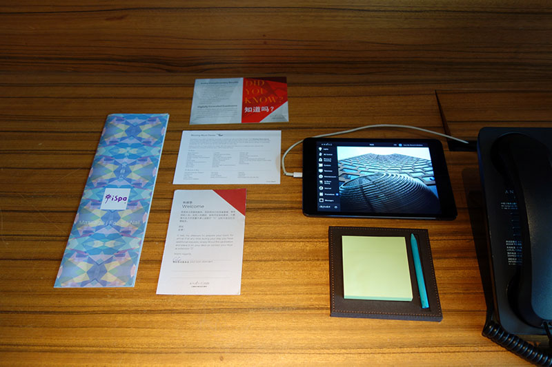 a tablet and papers on a table