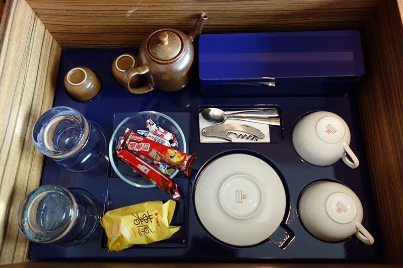 a tray with a tray of tea cups and cups