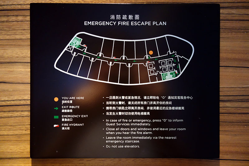 a sign with a map of a fire escape plan