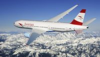 a plane flying over snowy mountains