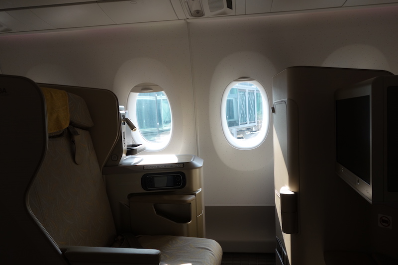 a seat and window in an airplane
