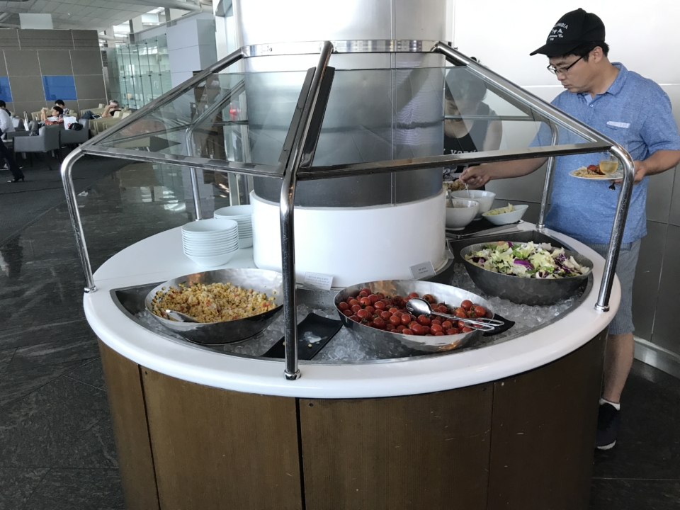 a man standing at a buffet