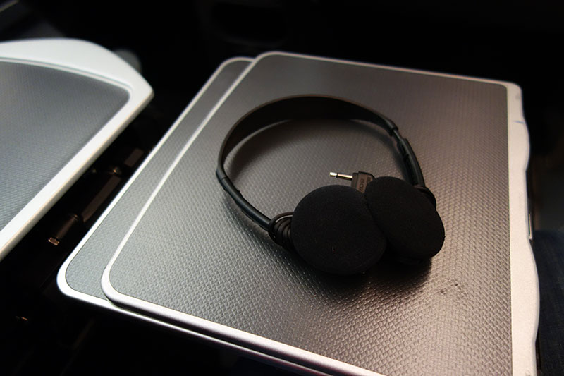 a pair of headphones on a grey surface