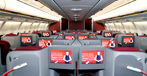 a row of seats with monitors on the side